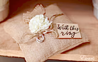 This is a cute and lovely little pillow with a rustic look holding the couple's rings.