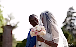 Walking to her handsome groom prepping to begin their married life and eternally overjoyed.
