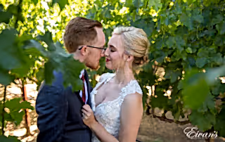 Gazing into one another's eyes while standing in the vineyard that only helps encompass their love and time.