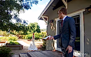 In a picture perfect moment from a fairytale itself while the groom holds his bride's shoes.