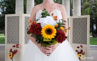 The bride's stunning bouquet is very bright and vibrant and entirely captures their perfect moment.