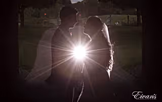 the couple gaze into one another's eyes while they erupt with deep passion and everlasting love.