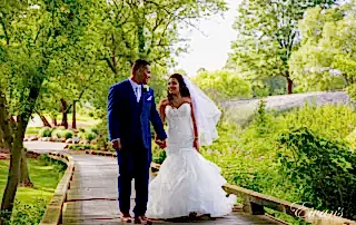 The couple walk together down a beautiful walk way in such an amazing environmental wonder.