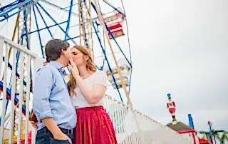 man and woman standing on bridge during daytime