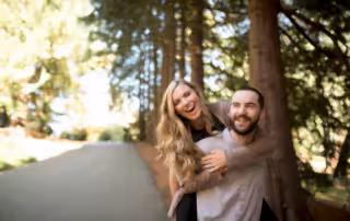 The gorgeous woods and even more stunning couple celebrate their never ending love while the soon-to-be groom carried his fiance on his back while they smile and laugh their worries away.