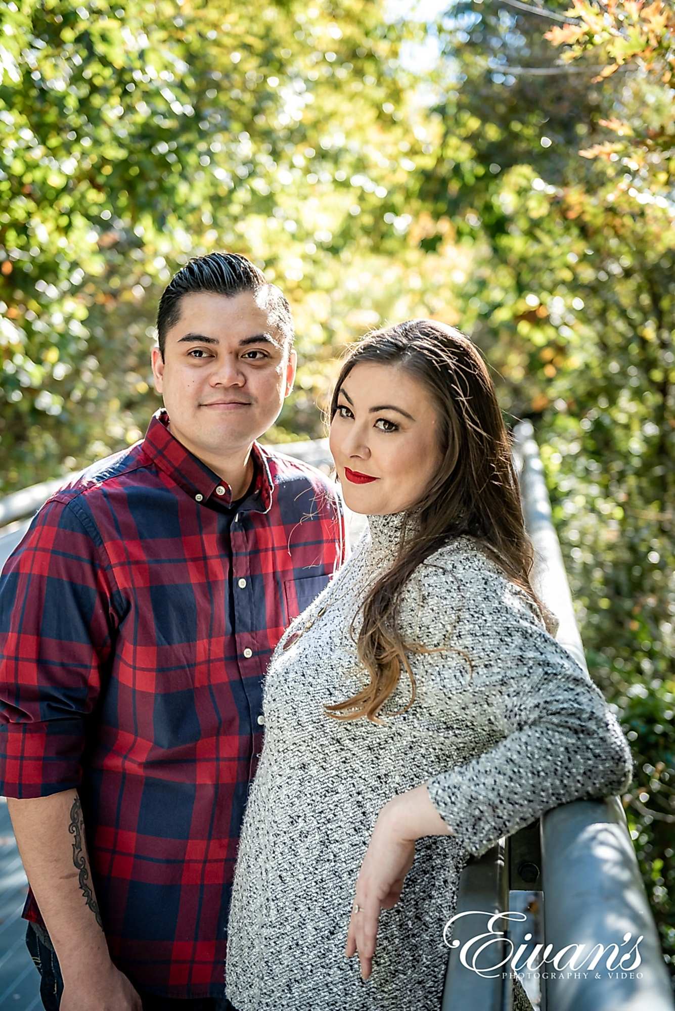 what-to-wear-for-your-engagement-photos-outdoors-bring-multiple-outfits engaged man and woman posing in a forest