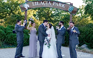 man in black suit jacket and woman in white wedding dress