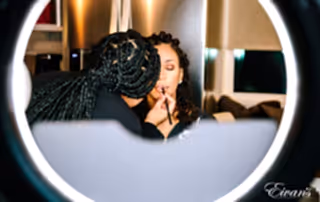 photo taken for two women making make up for lips